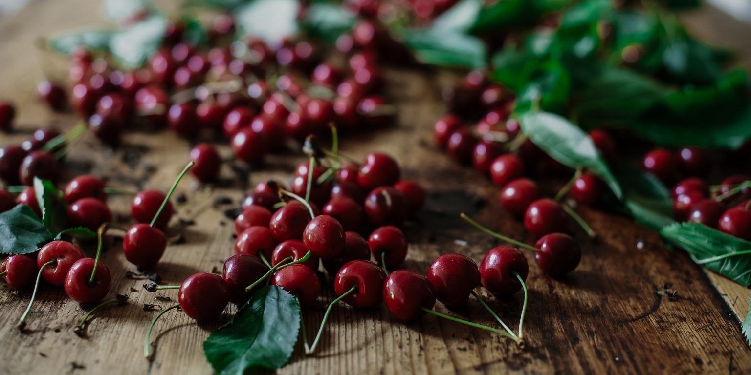 Fresh cherries on a wooden table