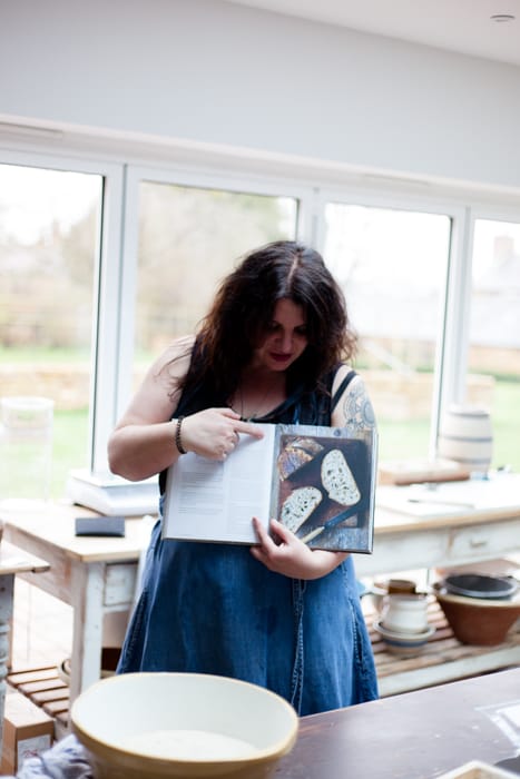 vanessa holding her book with Sourdough Loaf Record Forms to use when you bake
