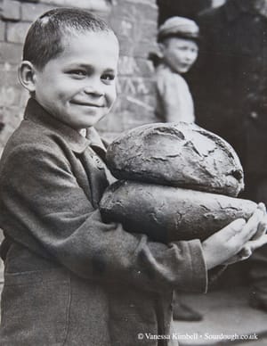 1946 – bread – people – poland 1946 – Boy with bread – Poland