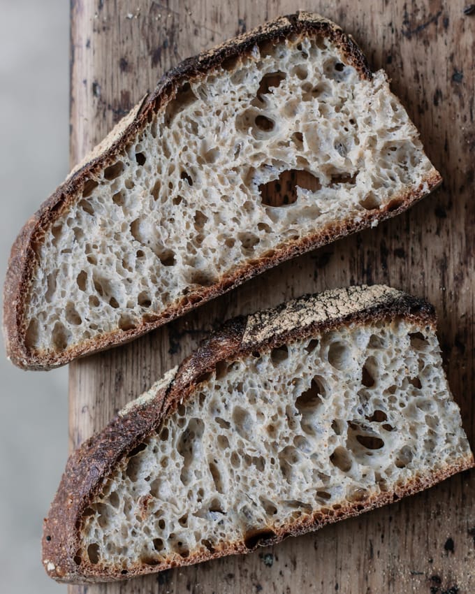 bubbly sourdough slices  - looking at the cost of baking a loaf of Sourdough bread at home