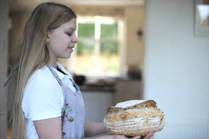 vanessa's daughter holding sourdough