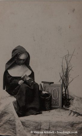 1922 – Nun with bread - France