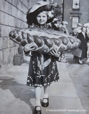 1951 – Girl with bread on the Old Kent Road - London