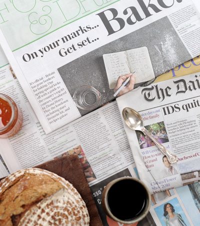 sourdough and coffee on The Telegraph newspaper